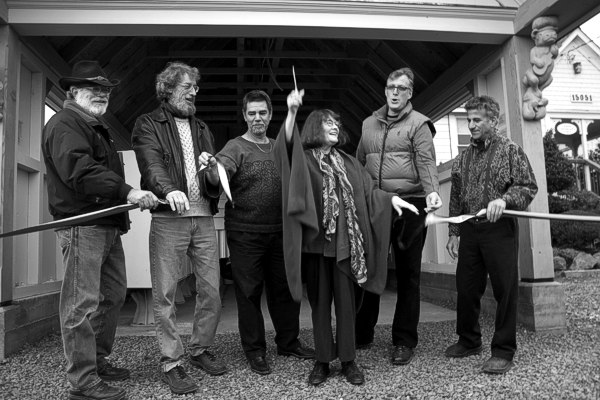 Ribbon cutting at the Dedication of the Caspar Mail Pavilion. From left: David Alden, head carpenter; Paul Reiber, sculptor; John Wozniak, foreman; Susan Juhl, ribbon cutter; Daniel Dickson, architect; and Paul Schulman, Caspar Board President.